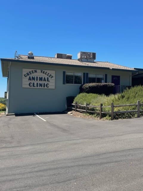 Side of the clinic building with a Green Valley Animal Clinic sign